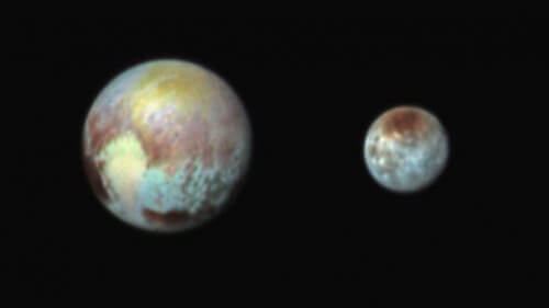 The dwarf planet Pluto (on the left) and its moons as a coffin in artificial colors that emphasize the differences in the route of the terrain and the composition of the materials on their surfaces. Photographed in three color filters by the Ralph instrument aboard the New Horizons spacecraft, July 13, 2015.