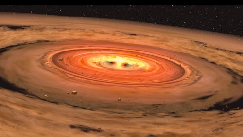 הדמיה של דיסקת אבק המקיפה ננס אדום. איור: NASA/JPL-Caltech/T. Pyle (SSC)