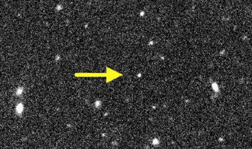 The dwarf planet (circled colored dots) as photographed three times two hours apart. The first photograph was artificially colored in red, the second in green and the third in blue. The stars and galaxies in the background have not moved and are painted white for convenience. Photo: Scott S Sheppard/Carnegie Institution for Science