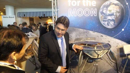 Science Minister Ofir Akunis at the SpaceIL booth at the IAC space conference in Jerusalem, November 2015. Photo: Avi Blizovsky