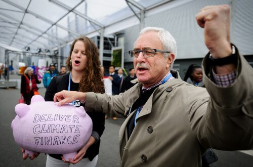 Protest at the conference. Who will pay for the agreement? Photo: Cop Paris