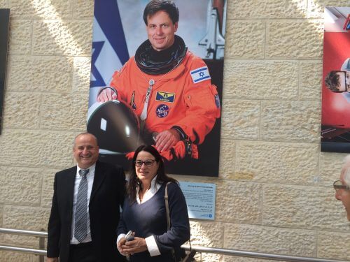 Director General of the Ministry of Science Peretz Wazen and Rona Ramon next to the picture of the late Ilan Ramon at the exhibition of 60 scientific achievements of Israel that influenced the world, 7/3/16. Photo: Avi Blizovsky