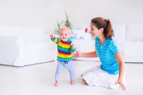 Baby takes first steps. Photo: shutterstock