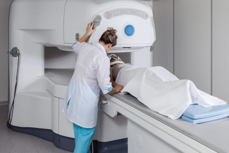 Technician and patient in preparation for MRI. Photo: shutterstock