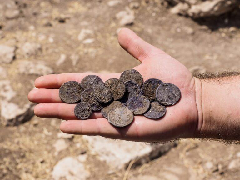 The cache of silver coins found in the mansion house from the Hasmonean period. Photo: Assaf Peretz, Antiquities Authority