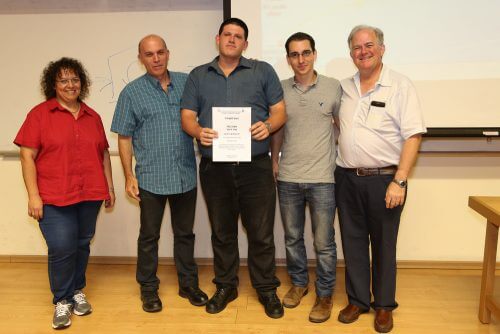 From right to left: Dean of the Faculty Prof. Amir Landsberg, the first place winners Or Dicker and Aviv Peleg, and the entrepreneurs Doron and Liat Adler who presented the award