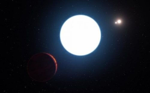 An artist's rendering shows the triple star system HD 131399 and the planet orbiting the giant star of the three HD 131399Ab visible in the lower left of the image. Photo: ESO / L. Calçada