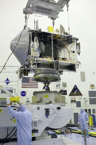 Osiris Rex is mounted on a rotating stand before experiments are performed on it. Source: NASA.