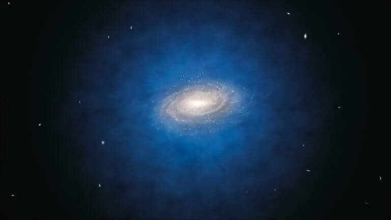 הדמייה של גלקסיית שביל החלב. ההילה הכחולה שמסביבה באה להמחיש את התפוצה המשוערת של החומר האפל סביב הגלקסייה. מקור: ESO/L. Calçada.