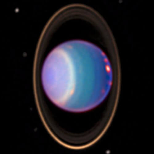 אורנוס בצילום של טלסקופ החלל האבל, ובו נראים גם טבעותיו. מקור: נאס"א.