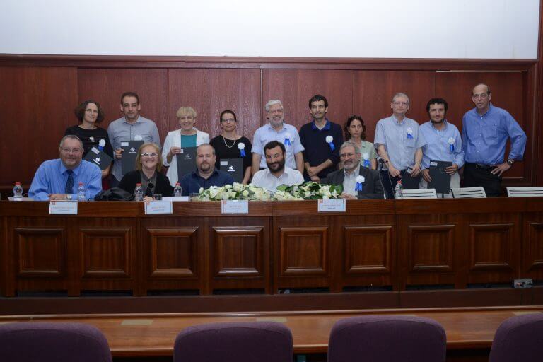In the photo from right to left are: Prof. Aryeh Tsavan, Vice President for Research, Prof. Haim Cohen, from Prof. Avraham Faust, Dr. Gabriela Geyer, Prof. Nir Lev, Prof. David Haneshka, Dr. Noa Agmon, Prof. Michal Zion , Prof. Avi Zadok, Prof. Sharon Aramon-Lotam, sitting from right to left: Prof. Edward Grinstein, Prof. Eliyahu Slutskin, Prof. Gal Kaminka, Prof. Miriam Faust, Rector of the University and Rabbi Prof. Daniel Hershkowitz, President of Bar-Ilan University. Photography: Meshulam Levy.