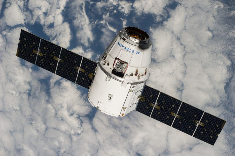 The Dragon spacecraft that was launched today, on its first mission to the space station in September 2014, in a photo from the space station itself. Source: NASA.