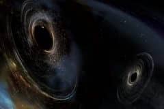 איור הממחיש כיצד נראים שני חורים שחורים מתמזגים הדומים לאלו שזוהו על ידי LIGO. החורים השחורים מסתובבים בצורה לא מיושרת כלומר יש להם אוריינטציות שונות ביחס לתנועה הכללית של מסלול הצמד. LIGO מצא רמזים לכך שמסלולו של לפחות חור שחור אחד במערכת GW170104 לא זוהה קודם לכן באמצעות התנועה המסלולית שלו לפני שהתמזג עם השותף שלו. איור: LIGO / Caltech / MIT / Aurore Simonnet