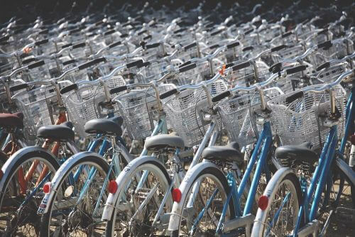 Bicycles in the city. Photo: Berto Macario on Unsplash.
