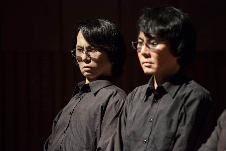 Prof. Hiroshi Ishiguro the human (right) and his robot double (left). Source: Florian Voggeneder / Ars Electronica.