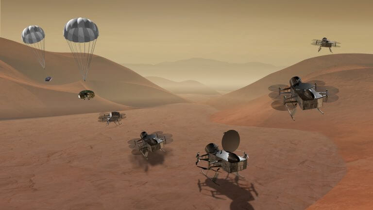 Simulation of the Dragonfly mission proposal - a rover will explore the surface of Titan, and will land after each flight to explore the surface and charge its batteries using a thermoelectric radioisotope generator (RTG). Source: NASA.