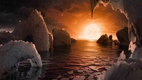 محاكاة لسطح السماء كما يمكن رؤيته من سطح الكوكب TRAPPIST-1f، وهو أحد الكواكب الثلاثة الجديدة الموجودة في المنطقة المضيفة للنجم القزم TRAPPIST-1. الكواكب السبعة في نظامه الكوكبي قريبة جدًا من بعضها البعض بحيث يمكن رؤيتها بوضوح من سطح أحدها. التصوير: ناسا/مختبر الدفع النفاث-معهد كاليفورنيا للتكنولوجيا.