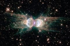 From ground-based telescopes, the so-called "ant nebula" (Menzel 3, or Mz 3) resembles the head and thorax of a garden-variety ant. This dramatic NASA/ESA Hubble Space Telescope image, showing 10 times more detail, reveals the "ant's" body as a pair of fiery lobes protruding from a dying, Sun-like star. The Hubble images directly challenge old ideas about the last stages in the lives of stars. By observing Sun-like stars as they approach their deaths, the Hubble Heritage image of Mz 3 - along with pictures of other planetary nebulae - shows that our Sun's fate probably will be more interesting, complex, and striking than astronomers imagined just a few years ago.
