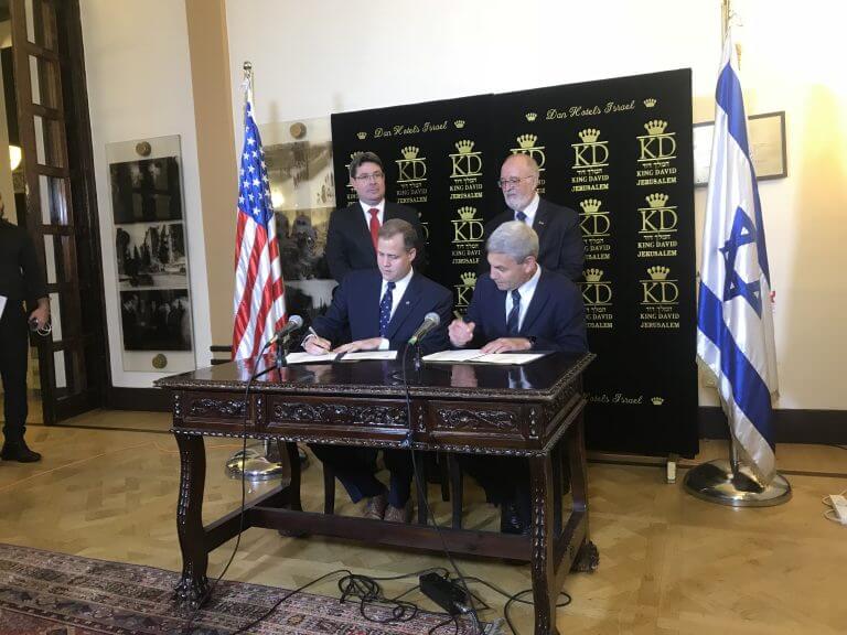 NASA Chief Jim Bridenstine (left, sitting) signs a cooperation agreement with Israel Space Agency Director Avi Blasberger. Behind are Science Minister Ofir Akunis and Space Agency Chairman Prof. Yitzhak Ben Israel. Photo: Avi Blizovsky