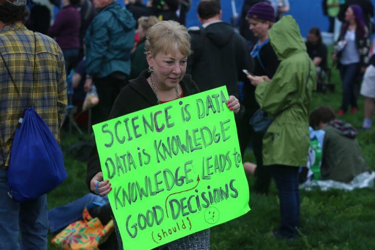 A participant in one of the marches for science, April 2017, explains why it is important to make decisions based on science. Photo: shutterstock