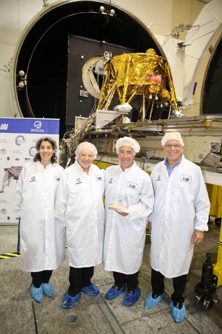From the right: CEO of the SpaceIL association Ido Antabi, donor Sylvan Adams, main donor to the Maurice Kahan spacecraft, and VP of the aerospace industry Inbal Kreis next to the SpaceIL association's Israeli spacecraft to the moon. Photography: Eliran Avital