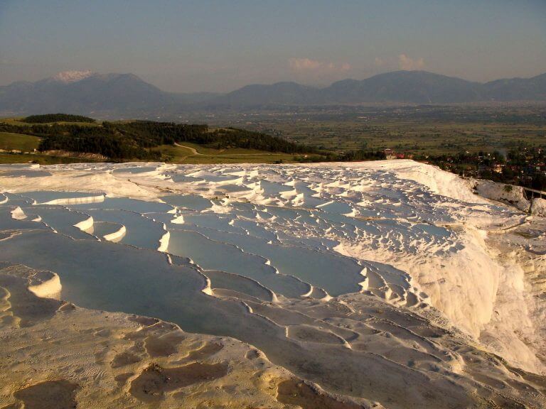 Pools at the Pamukkale site in Turkey, with travertine deposits. By Josep Renalias [CC BY-SA 3.0 (https://creativecommons.org/licenses/by-sa/3.0)], from Wikimedia Commons