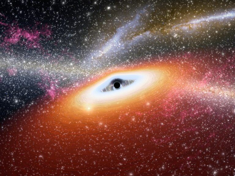 الصورة: قرص من الغاز يغذي ثقبًا أسود ضخمًا، بينما ينبعث منه الإشعاع. حقوق الصورة: NASA/JPL-Caltech