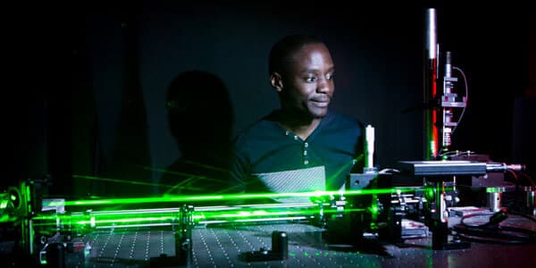 One of the researchers activates the laser beam as part of the experiments [Courtesy: Wits University]