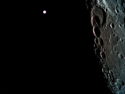 The surface of the moon, as photographed from the Bereshit spacecraft from an altitude of 470 km, with the Earth in the background. Photo: SpaceIL and the Aerospace Industry