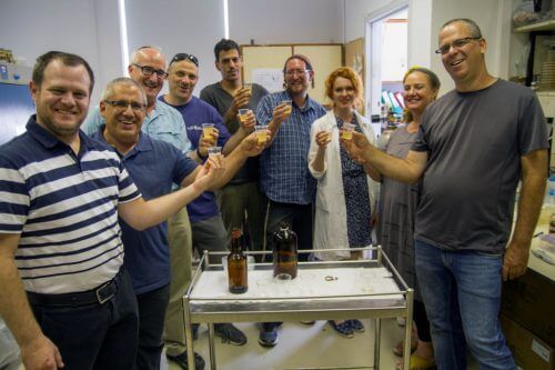 The researchers who recreated Philistine beer in the laboratory drink from it. Photo: Yaniv Berman, Antiquities Authority