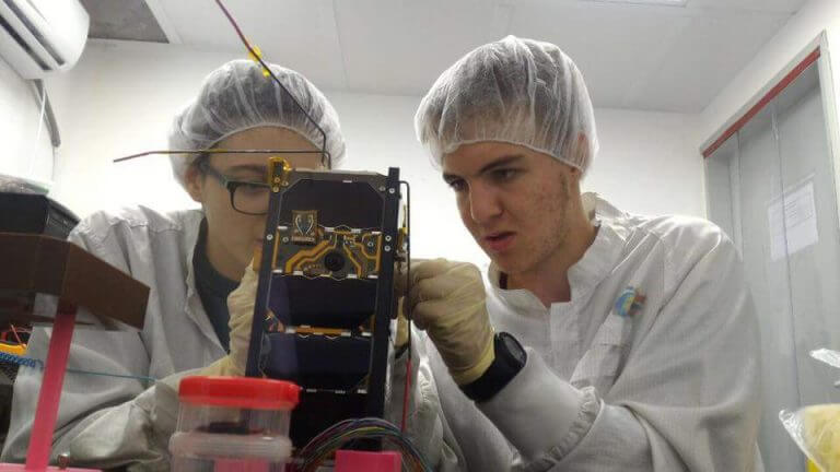 High school students assemble the Dokifat 3 satellite. Photo: Herzliya Science Center