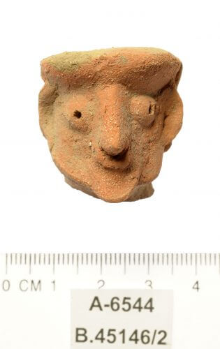 A figurine head in the form of a man. Photo: Clara Amit, Antiquities Authority