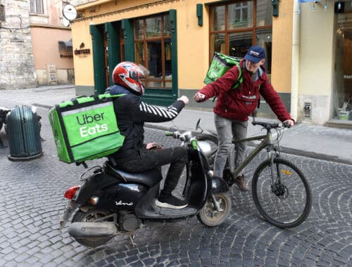 The haggling economy, Uber converted to food delivery, Lviv, Ukraine, February 2020. Photo: shutterstock