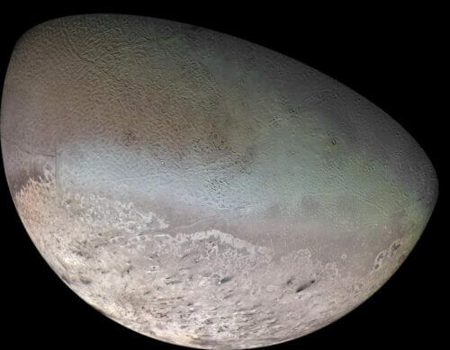 Triton as captured by the Voyager 2 spacecraft camera in 1989. Dozens of nitrogen geysers have been identified in the South Pole region - a finding that may indicate the existence of an underground ocean