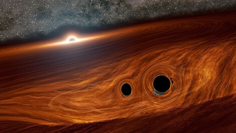 חורים שחורים מתנגשים בסמיכות לחור שחור ענק. (Credit: Caltech/R. Hurt (IPAC))
