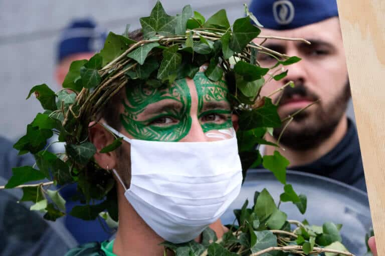 A protester near the European Union offices in Brussels, 27/6/2020. A green demonstration in the shadow of the corona. Photo: shutterstock