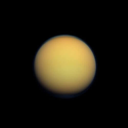 Titan's atmosphere makes it look like a fluffy orange ball. NASA photo