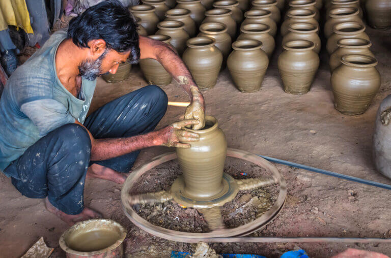 A potter makes water jugs in the city of Ahmedabad in India. Photo: shutterstock