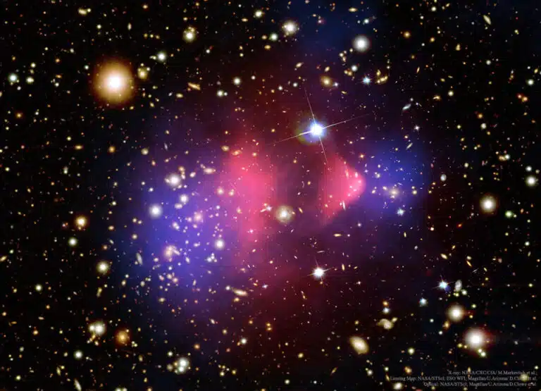 the bullet cluster. An area with a high concentration of dark matter. From NASA's Image of the Day, 2015. Image Credit: X-ray: NASA/CXC/CfA/ M. Markevitch et al.; Lensing Map: NASA/STScI; ESO WFI; Magellan/U.Arizona/ D.Clowe et al. Optical: NASA/STScI; Magellan/U.Arizona/D.Clowe et al.