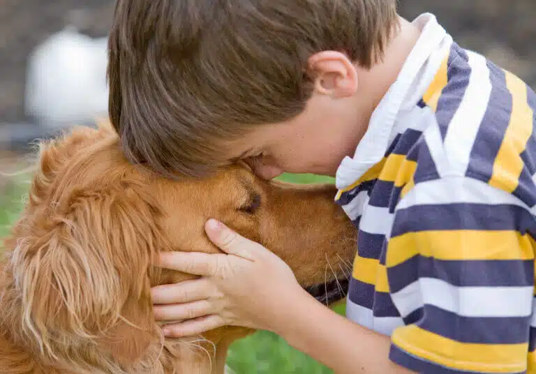 A boy and his dog. Photo: depositphotos.com