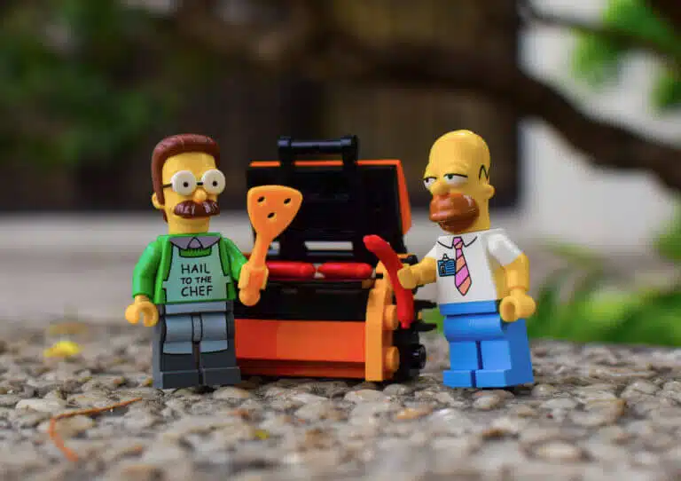 Lego figures of Homer Simpson and his neighbor Ned Flanders having a barbecue. Note that Symphon holds the instrument in his right hand while Flanders in his left. Flanders is also the owner of a store for left-handed products. Illustration: shutterstock