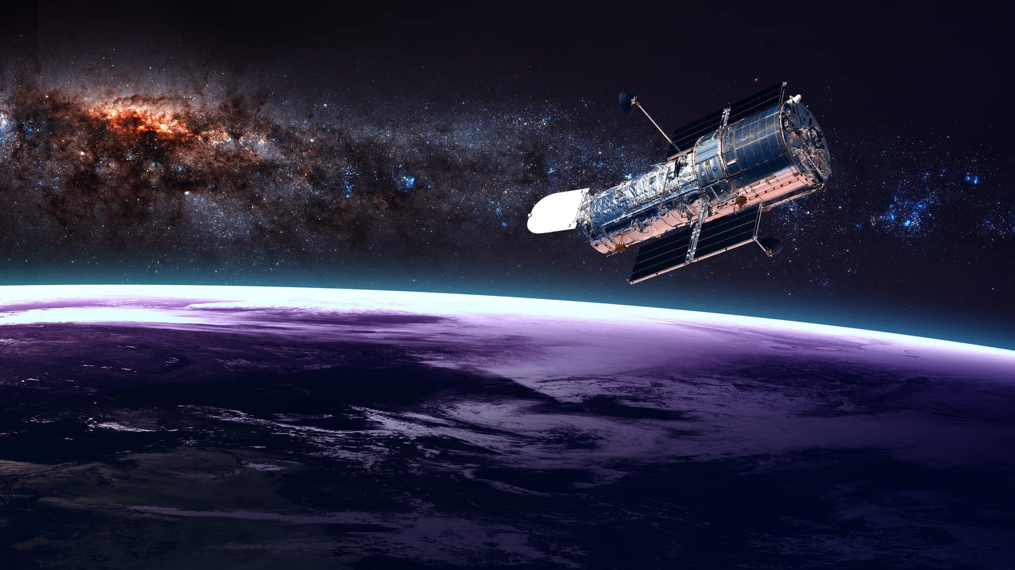 The Hubble Space Telescope on the background of photos he took. Illustration: depositphotos.com