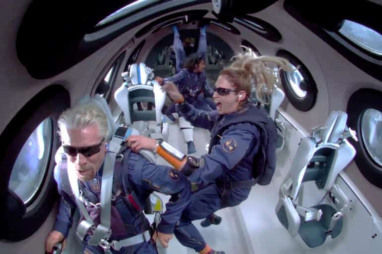 Richard Branson and the passengers who accompanied him on the first suborbital flight. PR photo, Virgin Galactic