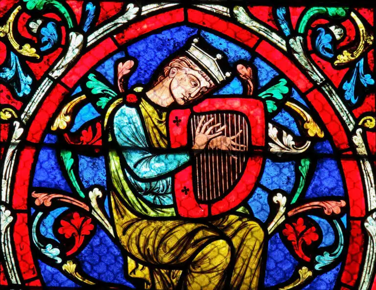 King David plays the harp. Stained glass in Notre Dame Cathedral in Paris. Illustration: depositphotos.com