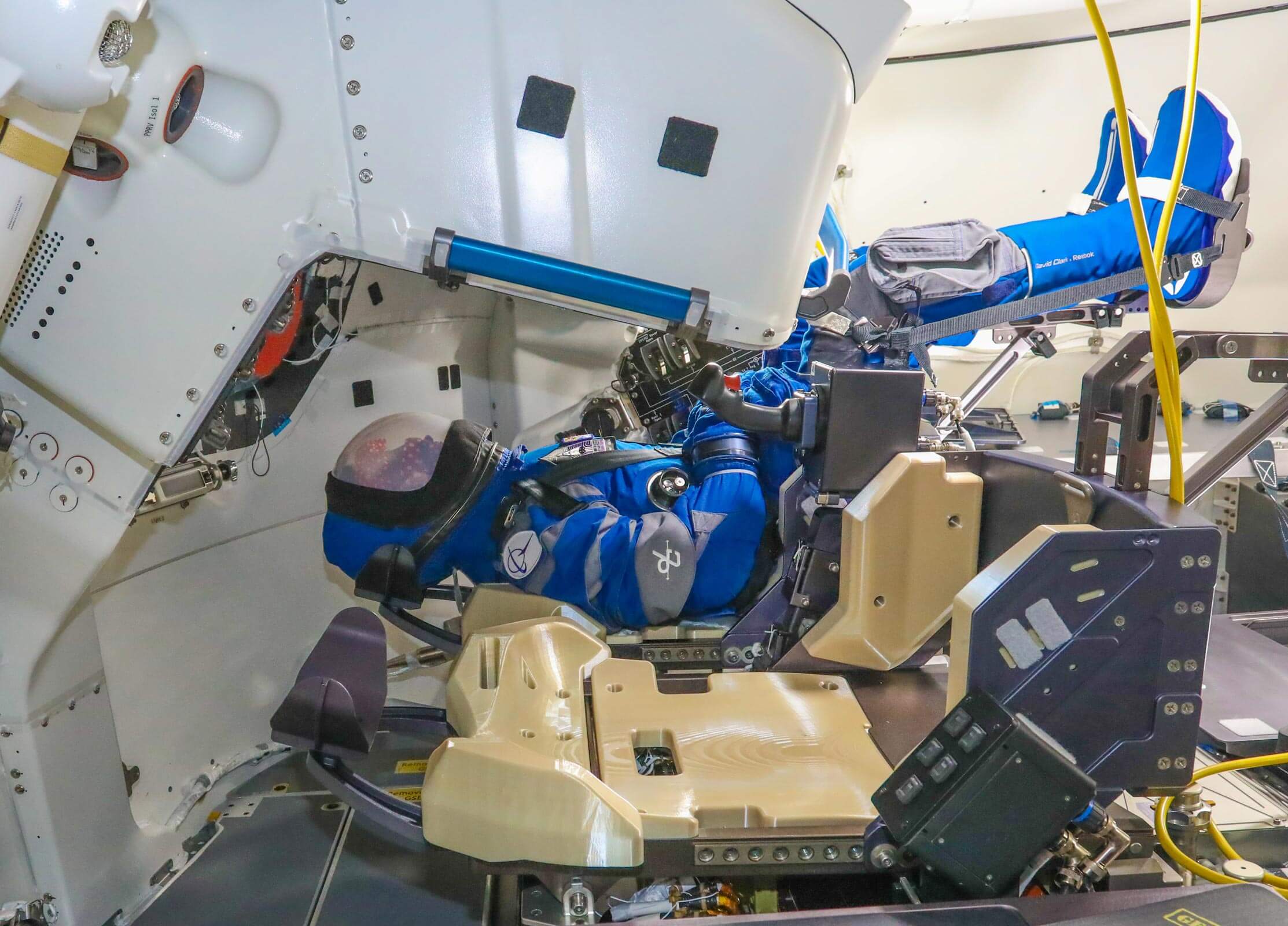 Rosie the Rocketeer, Boeing's anthropometric test device, has taken her place once again in the commander's seat of the company's Starliner spacecraft on its second unmanned flight. The first flight provided hundreds of data on what the astronauts would experience during the flight. On this flight, Rosie will help maintain the spacecraft's center of gravity during launch, docking, disengagement and landing. Credit: Boeing/John Proferes