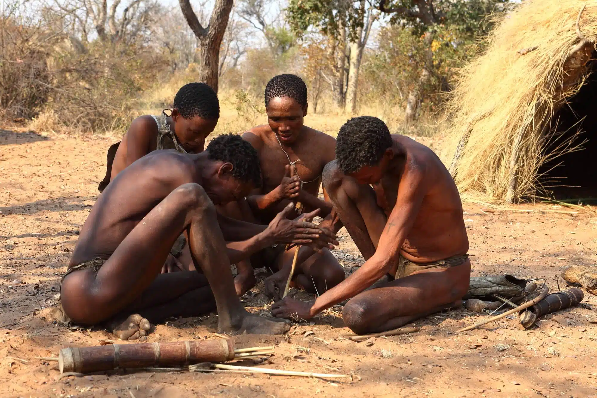 Bushmen in Africa light a fire together. Image: depositphotos.com