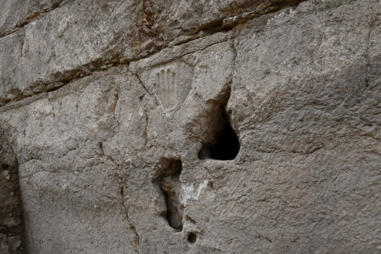 The hand carved in the wall of the moat. Photo by Yuli Schwartz, Antiquities Authority