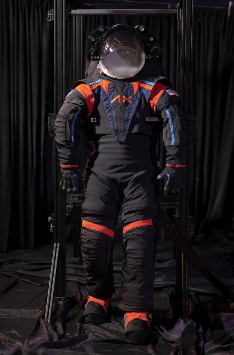 The Artemis III space suit prototype, the AxEMU. Although this prototype is covered in a dark gray cover material, the final version will likely be completely white when worn by NASA astronauts on the lunar surface, to help keep the astronauts safe and cool as they work in the harsh environment of space. Credit: Axiom Space