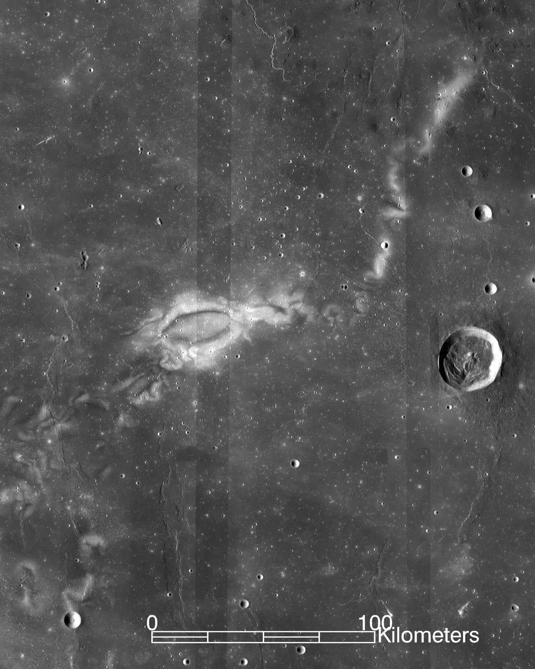 This image taken by the Lunar Survey Orbiter shows the gamma ray, a bright spot in the dark ocean of storms on the far side of the moon. The orbiter's view reveals tendrils that stretch several hundred kilometers across. Lunar vortices are bright, often twisting shapes that look like an abstract painting. They are unique to the Moon. Credit: NASA LRO WAC science team