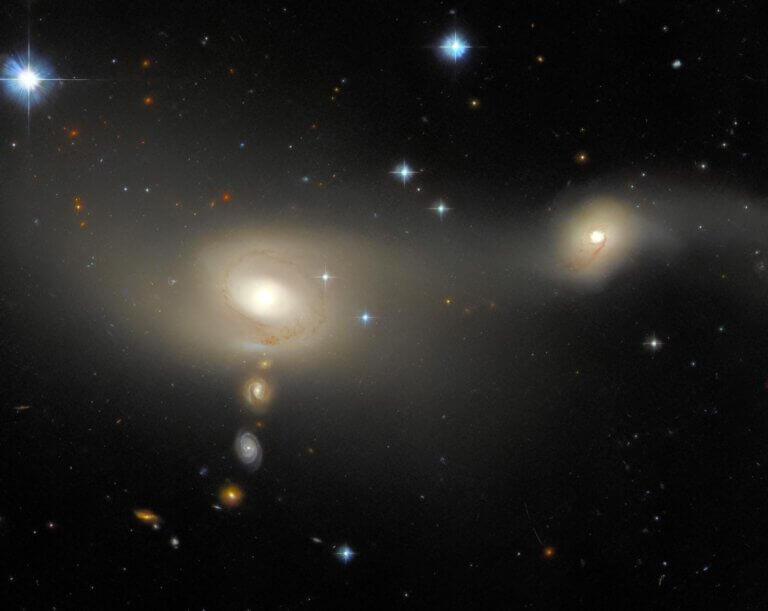 This image taken by the Hubble Space Telescope shows Aram-Mador 2105-332, a unique galaxy system in the Microscope Group. It is known for its emission line galaxies, which indicate vigorous star formation. It appears in Hubble's picture of the week, and that the names were given to galaxies using astronomical coordinates. Credit: ESA/Hubble & NASA, J. Dalcanton, Acknowledgment: L. Shatz